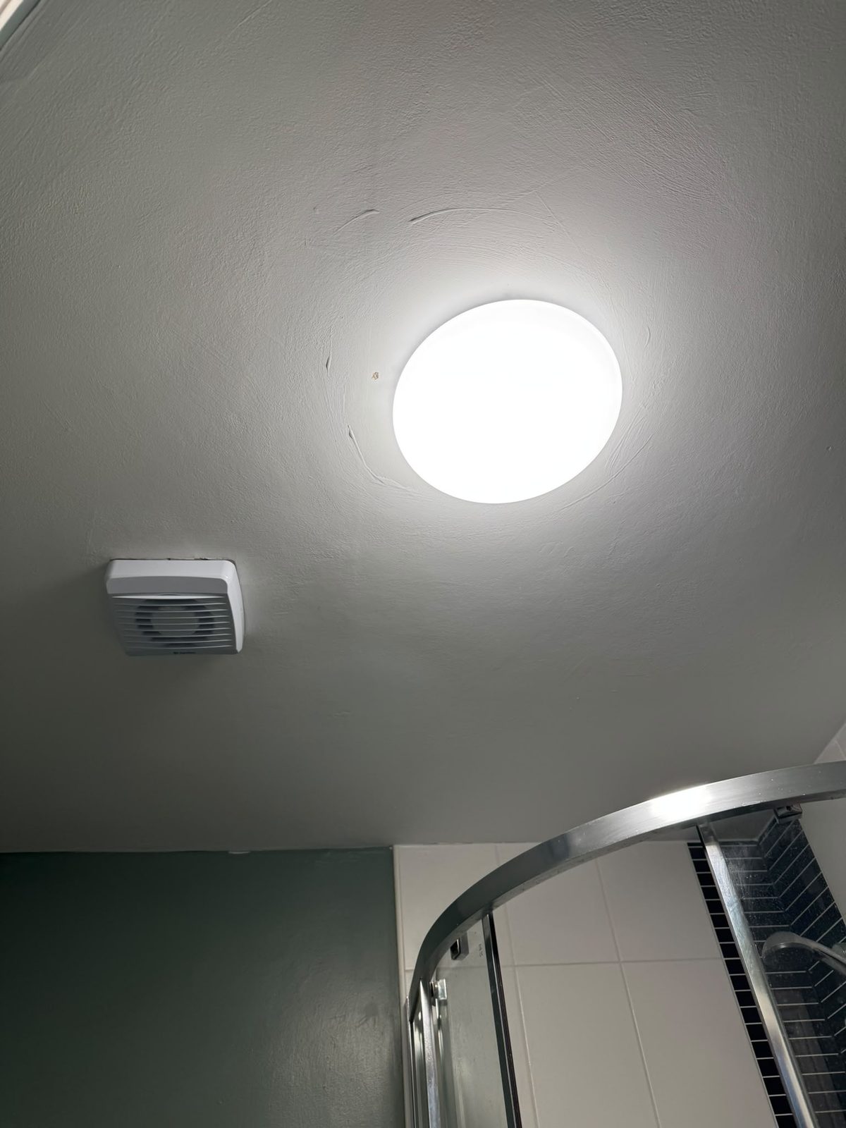 Bathroom ceiling light and extractor fan installed